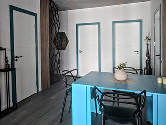 Original layout of the apartment included a large corridor area right in the center of the plan. In order to use the space in the most efficient way I decided to convert this otherwise useless space into a dining area. It was a very challenging task because being the very center the diving area was surrounded by 8 different areas, and 4 of them had to be behind doors. Out of remaining 4 here you can see the same laser cut divider between the hall and the entry area.