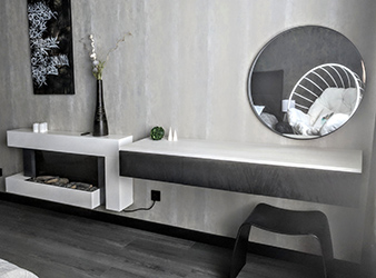 As you relax in the lounge chair or on the bed you can see the combination on the opposite wall. A small study or beauty zone and an electric fireplace.