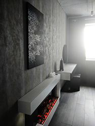 Given the whole Nordic feel and electric fireplace glowing like insides of a volcano the calligraphy art by a local Ukrainian artist looks almost like ancient Icelandic runes.